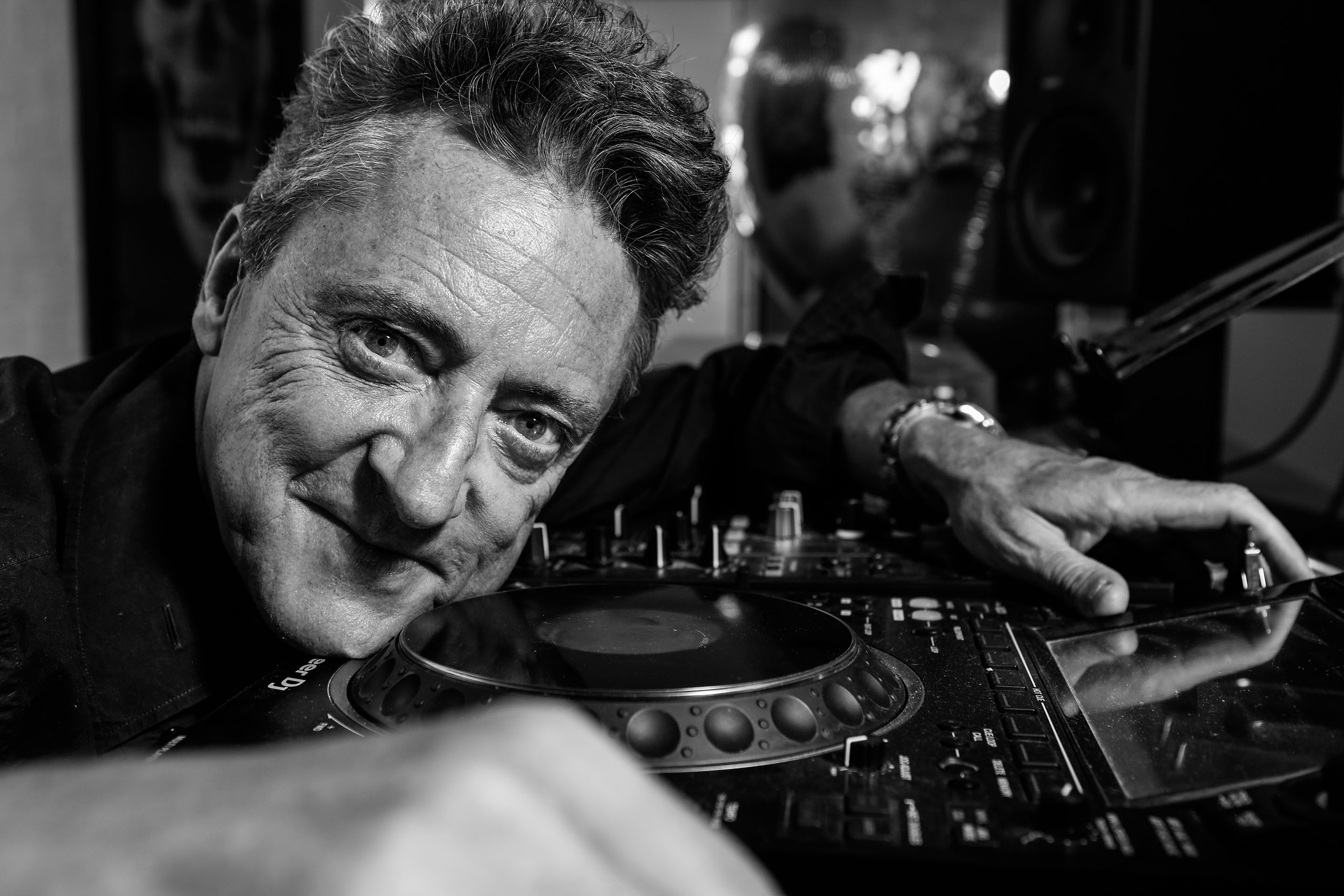 Jeremy Healy leaning into the decks mid-set