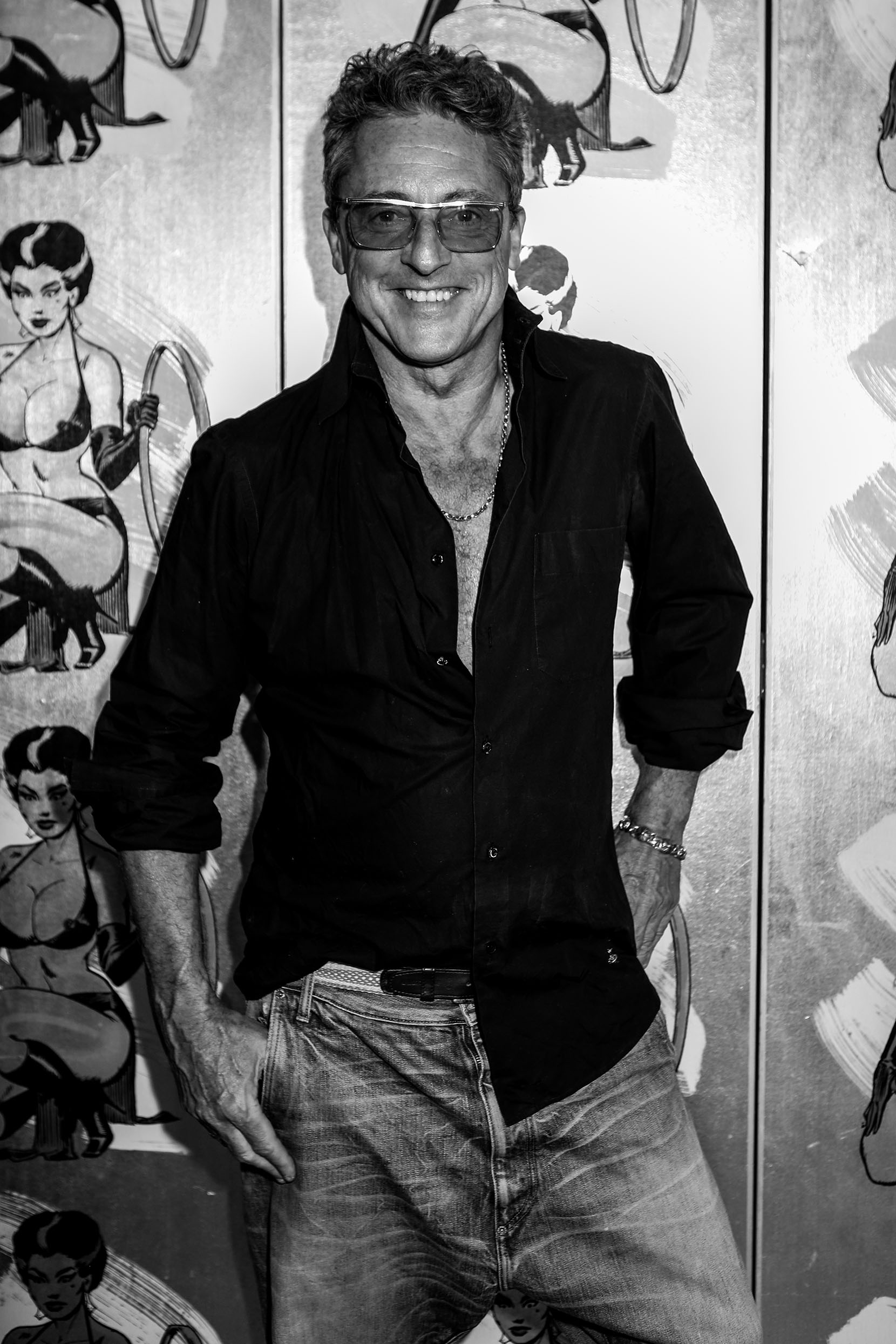 Jeremy Healy against a pin-up illustrated backdrop